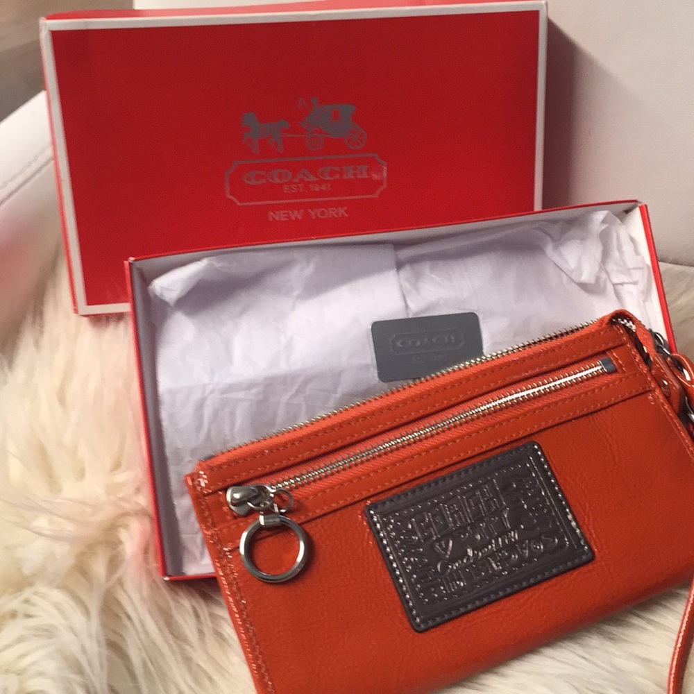 Coach orange wristlet